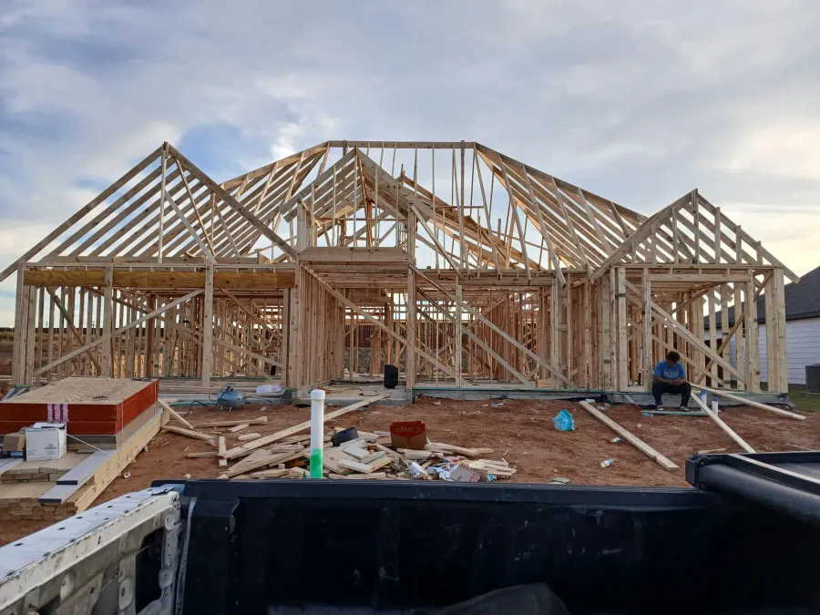 Complete wood frame of a single-family home with roof trusses in place