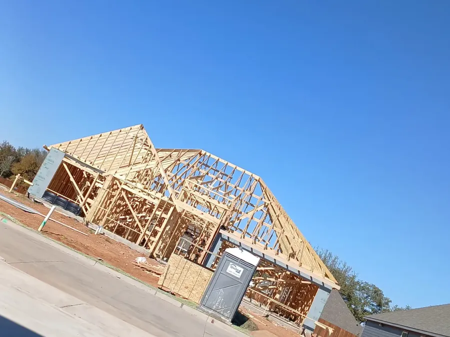 Framed house seen from the street in a new residential development