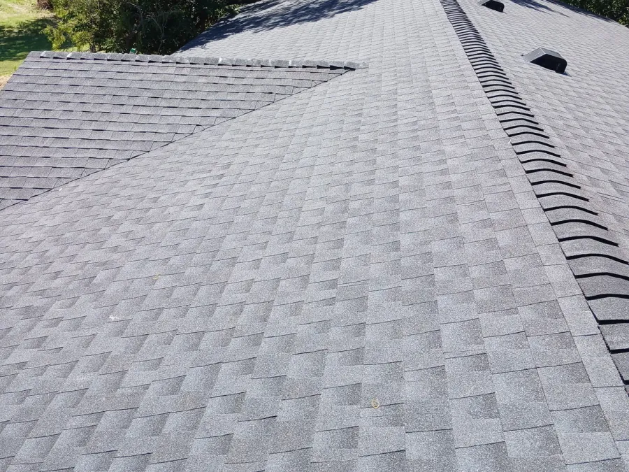Hip roof finished in architectural shingles with a continuous ridge vent